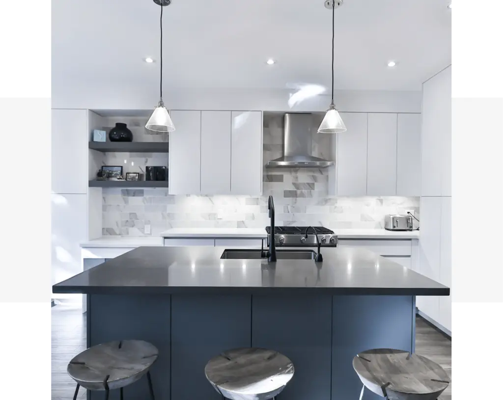 A contemporary home kitchen with a sleek black island and stools.
