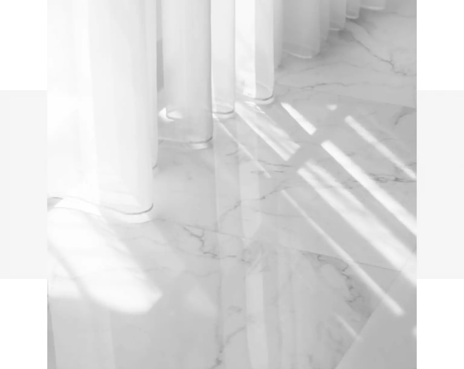 A black and white photo capturing a marble floor.