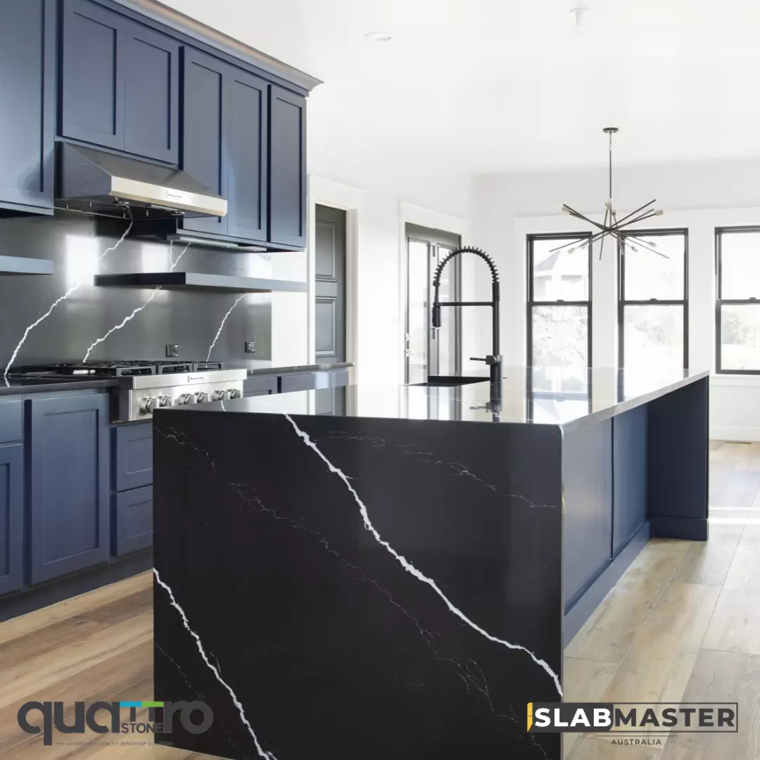 A kitchen with black marble countertops and black cabinets is both elegant and modern.