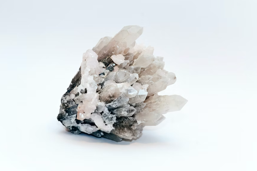 A cluster of white and black crystals on a white background.